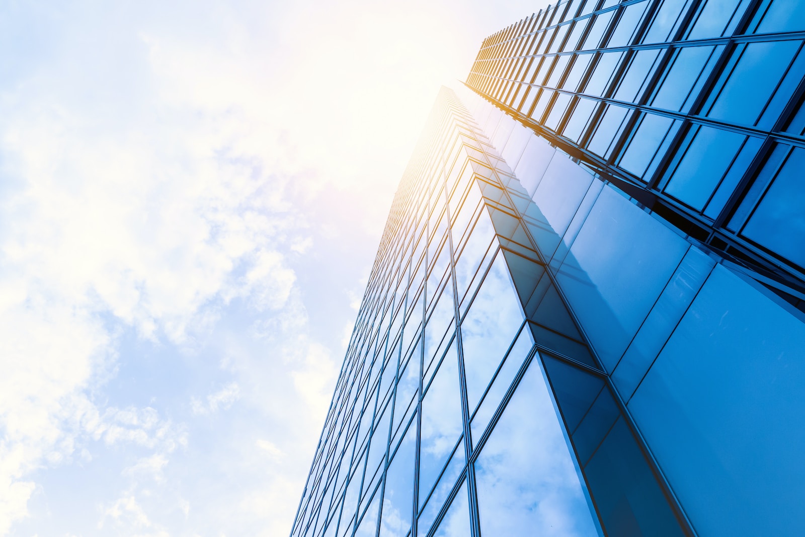 low-angle photo of curtain wall building